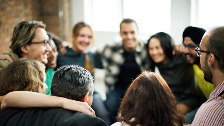 Business team building Happy people huddling in a room